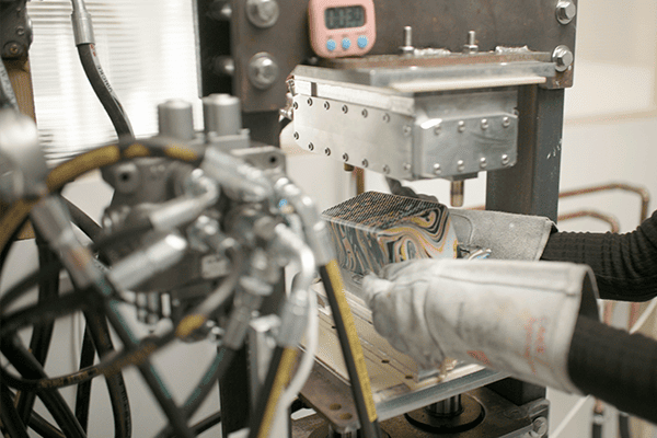Crimped hydraulic fitting close-up, machine crimping process